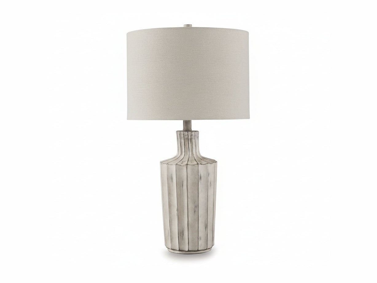 Imre table lamp with a textured glass base and beige lampshade on a white background