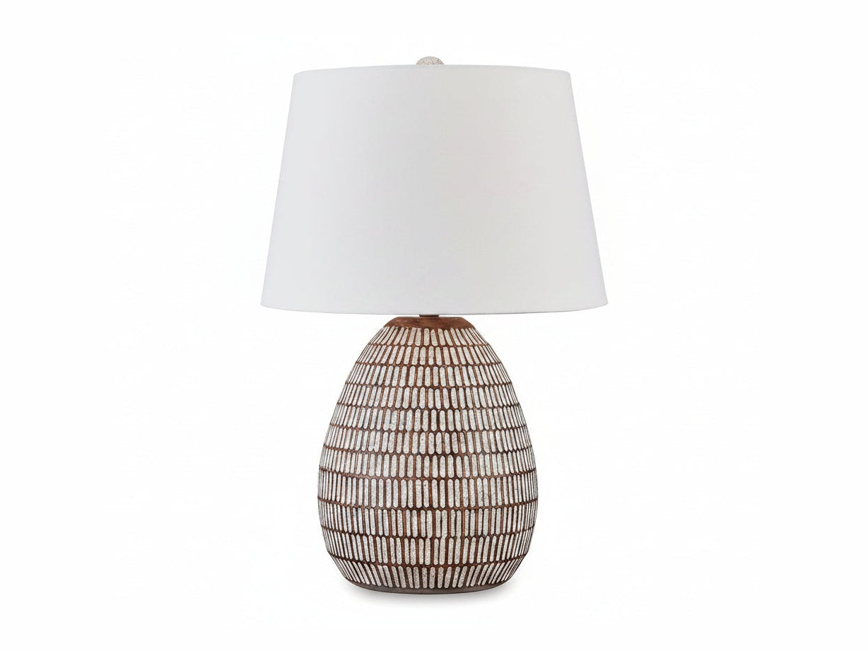 Darrich table lamp with textured ceramic base and white shade on a white background