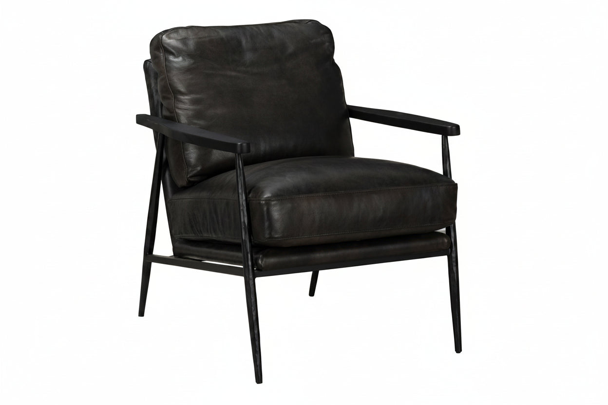 Black leather armchair with metal legs on a white background