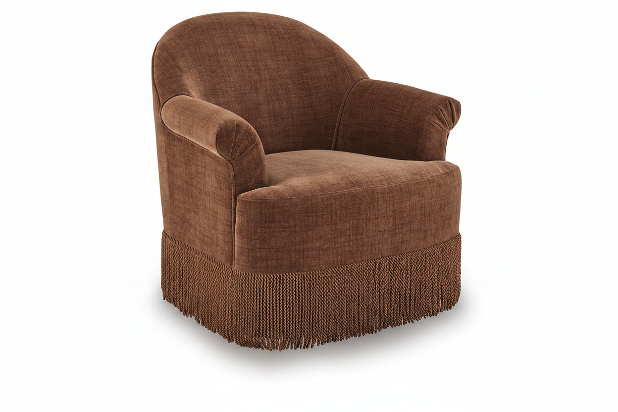 A brown upholstered accent chair with a rounded back, rolled arms, and a fringed skirt base, shown on a clean white background.
