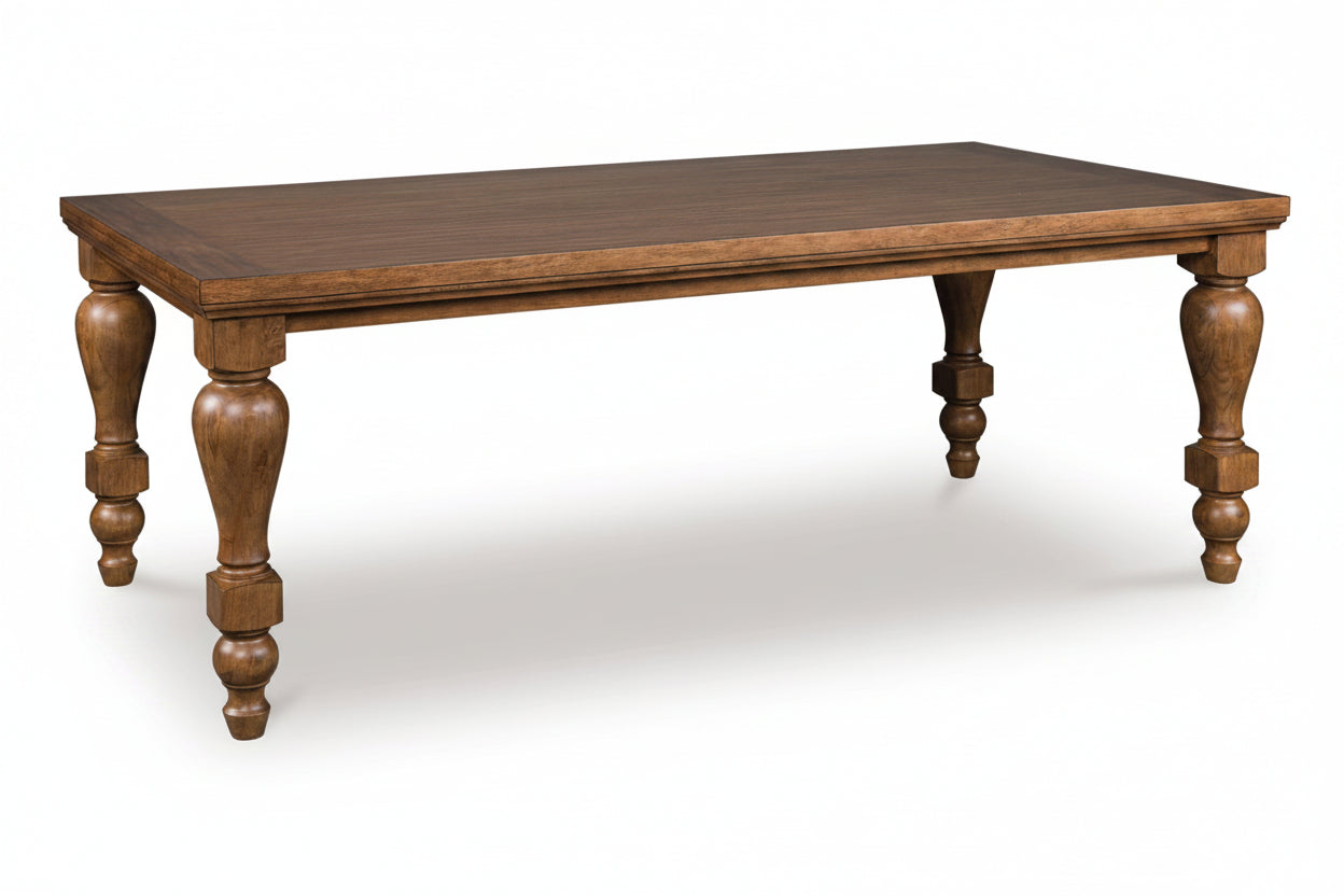 Wooden dining table with turned legs on a white background
