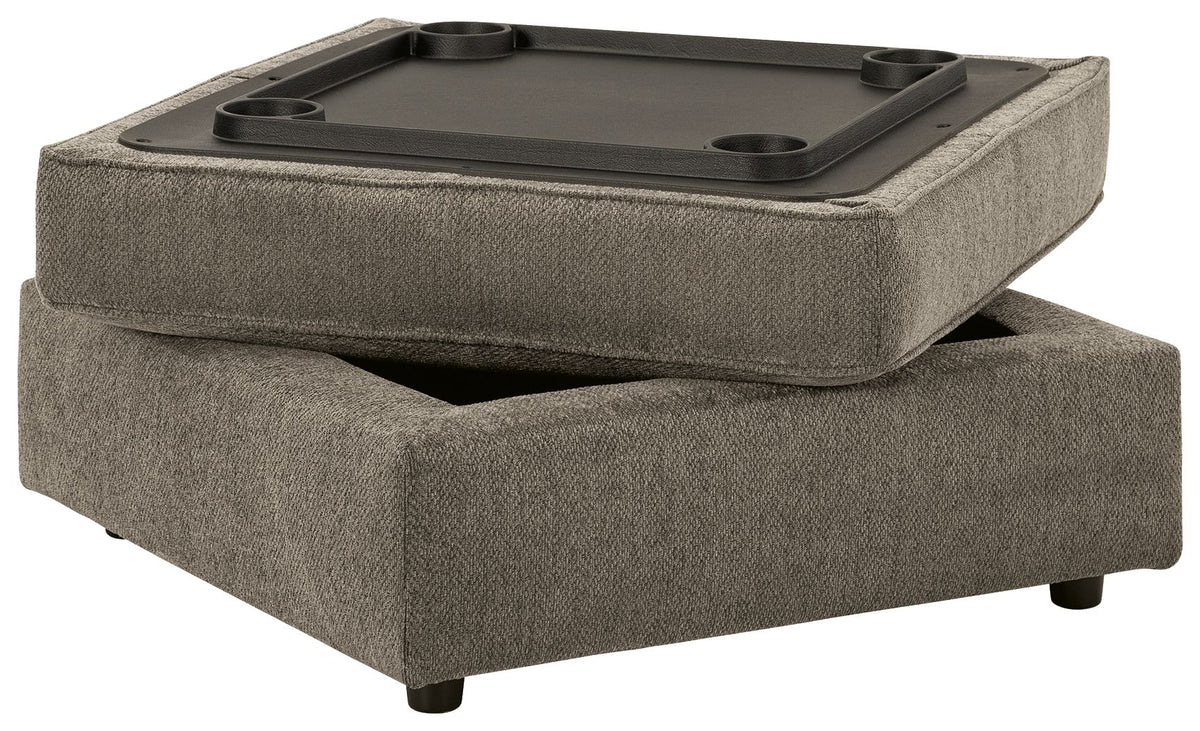 Gray fabric ottoman with a black game board on top