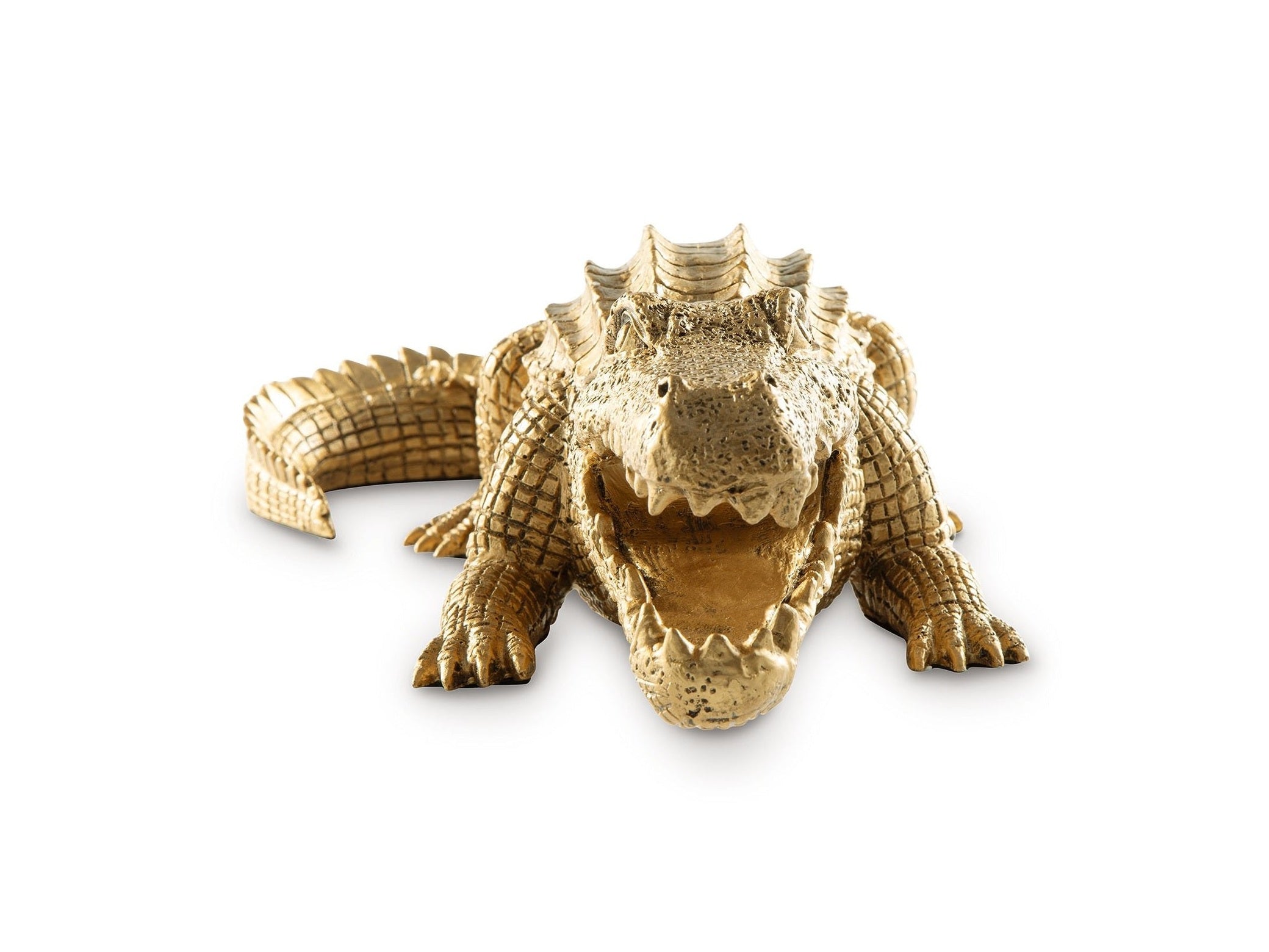 Gold alligator figurine on a white background