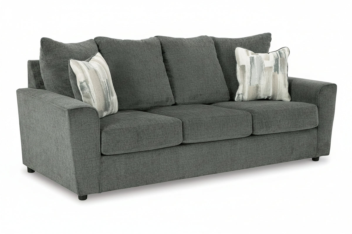 Gray sofa with patterned cushions on a white background