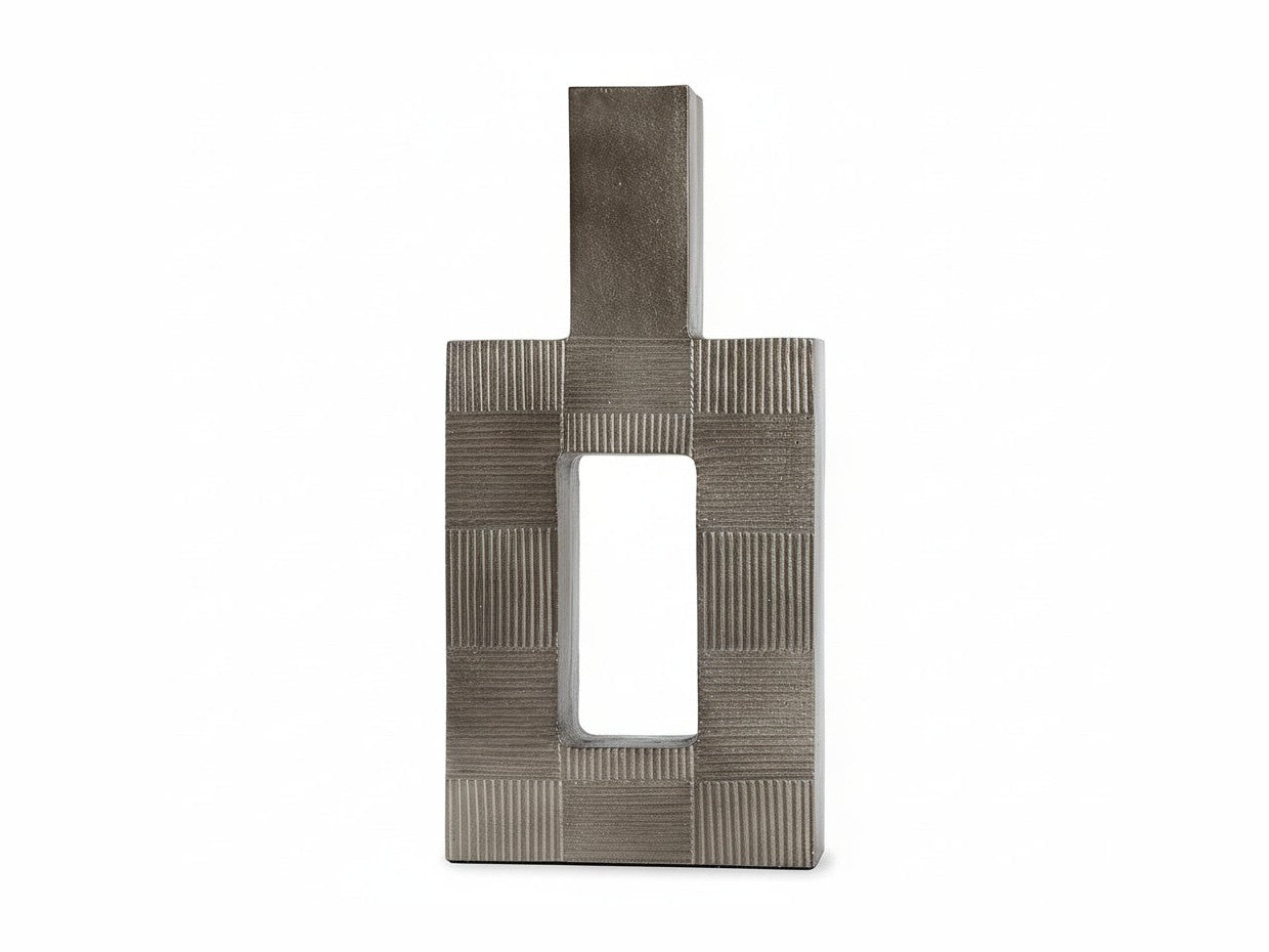 Wrengove decorative metal sculpture with textured surface on a white background.