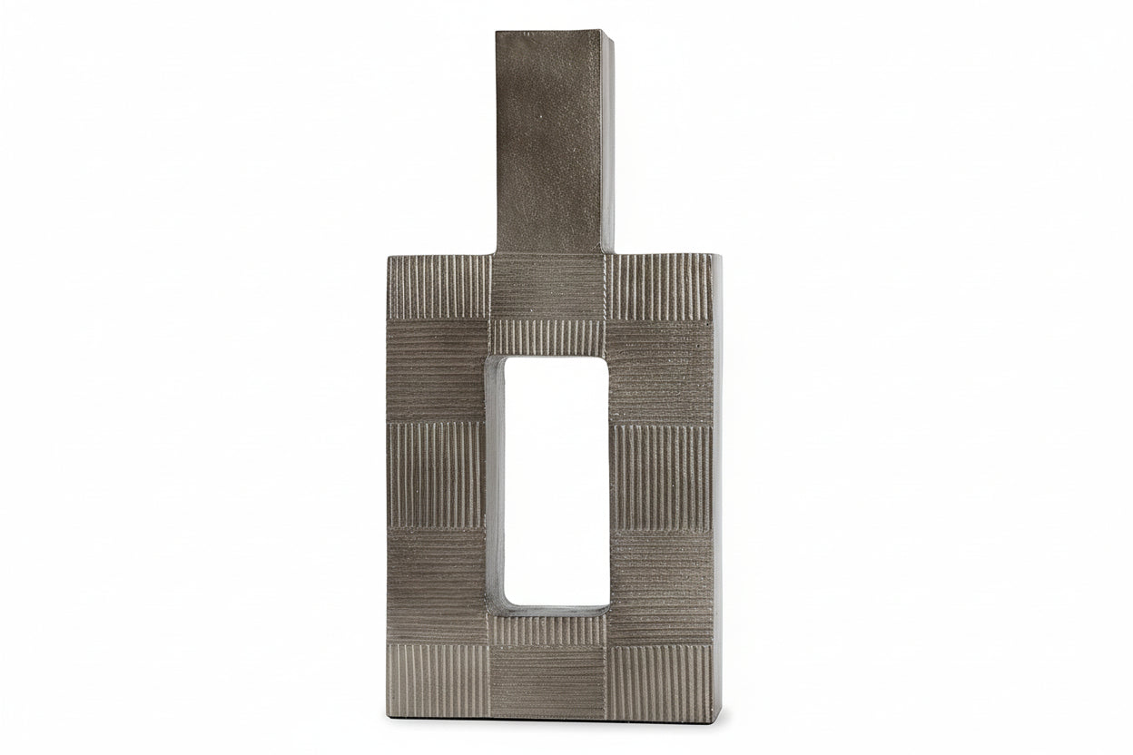 Wrengove decorative metal sculpture with textured surface on a white background.