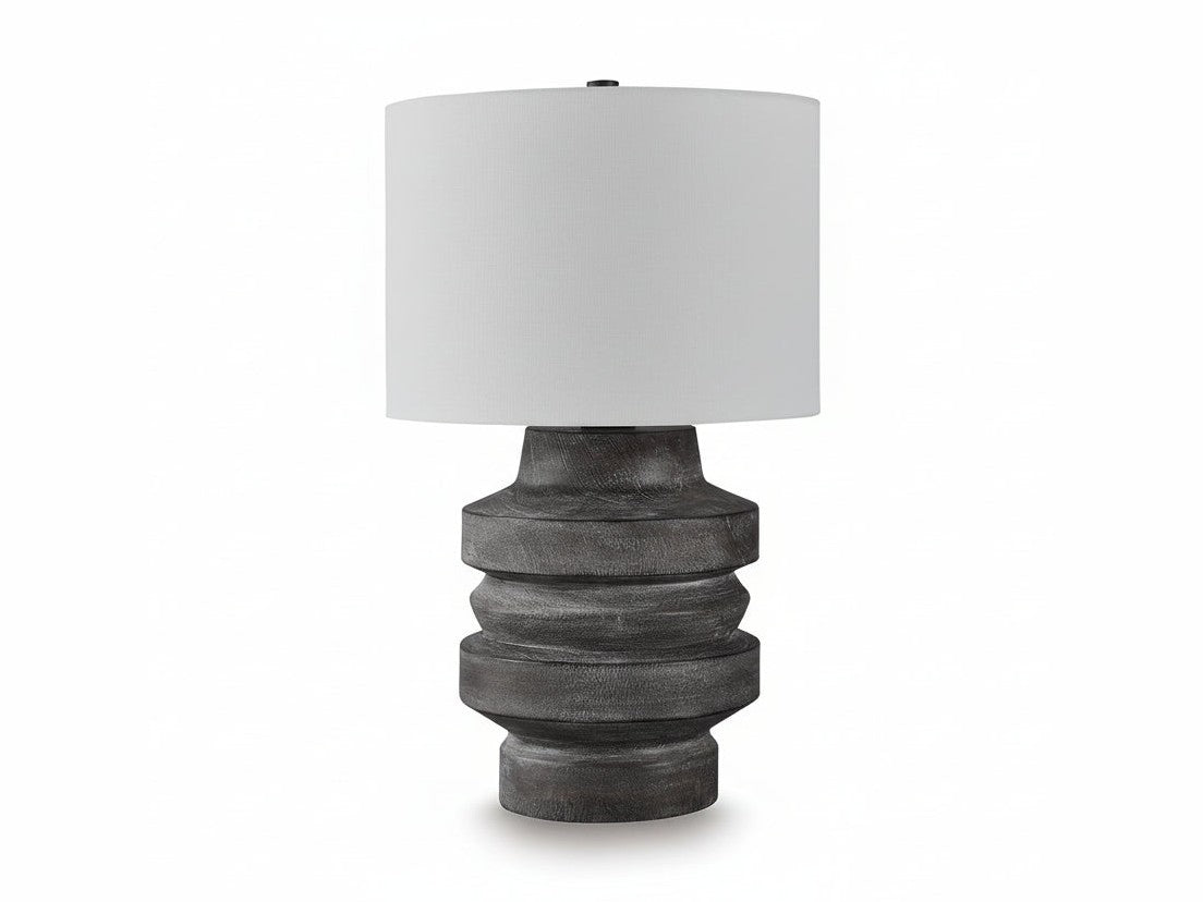 Wahida table lamp with a textured gray base and white shade on a white background