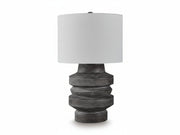 Wahida table lamp with a textured gray base and white shade on a white background