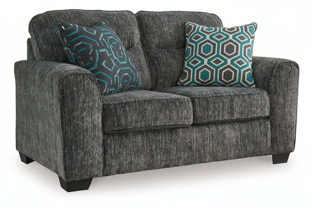 A two-seater loveseat sofa upholstered in a dark heathered gray fabric, featuring two decorative throw pillows with a beige and gray geometric pattern, set against a plain white background.