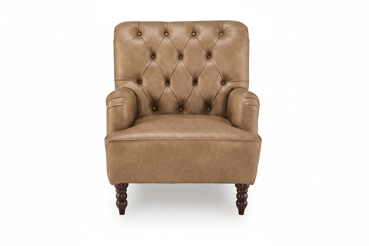 A classic tufted armchair upholstered in warm tan leather with dark brown turned wooden legs, shown against a plain white background.
