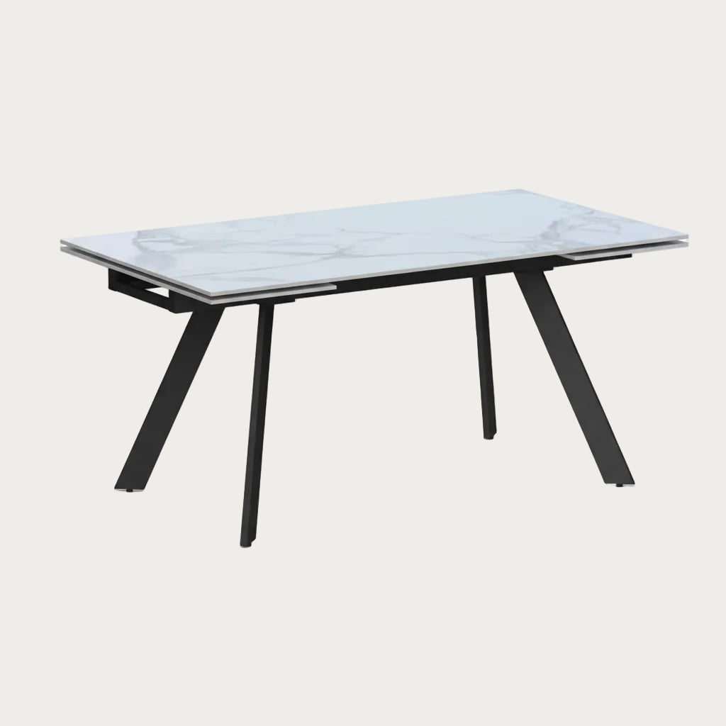 Alexandra rectangular dining table with a marble-like top and black metal legs on a white background