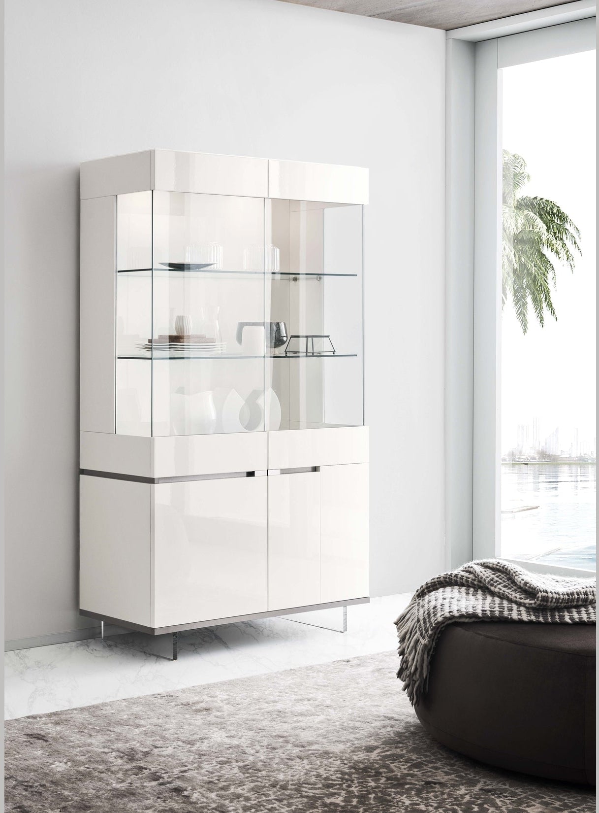 An Artemide white display cabinet in a minimalistic room with a window and rug.