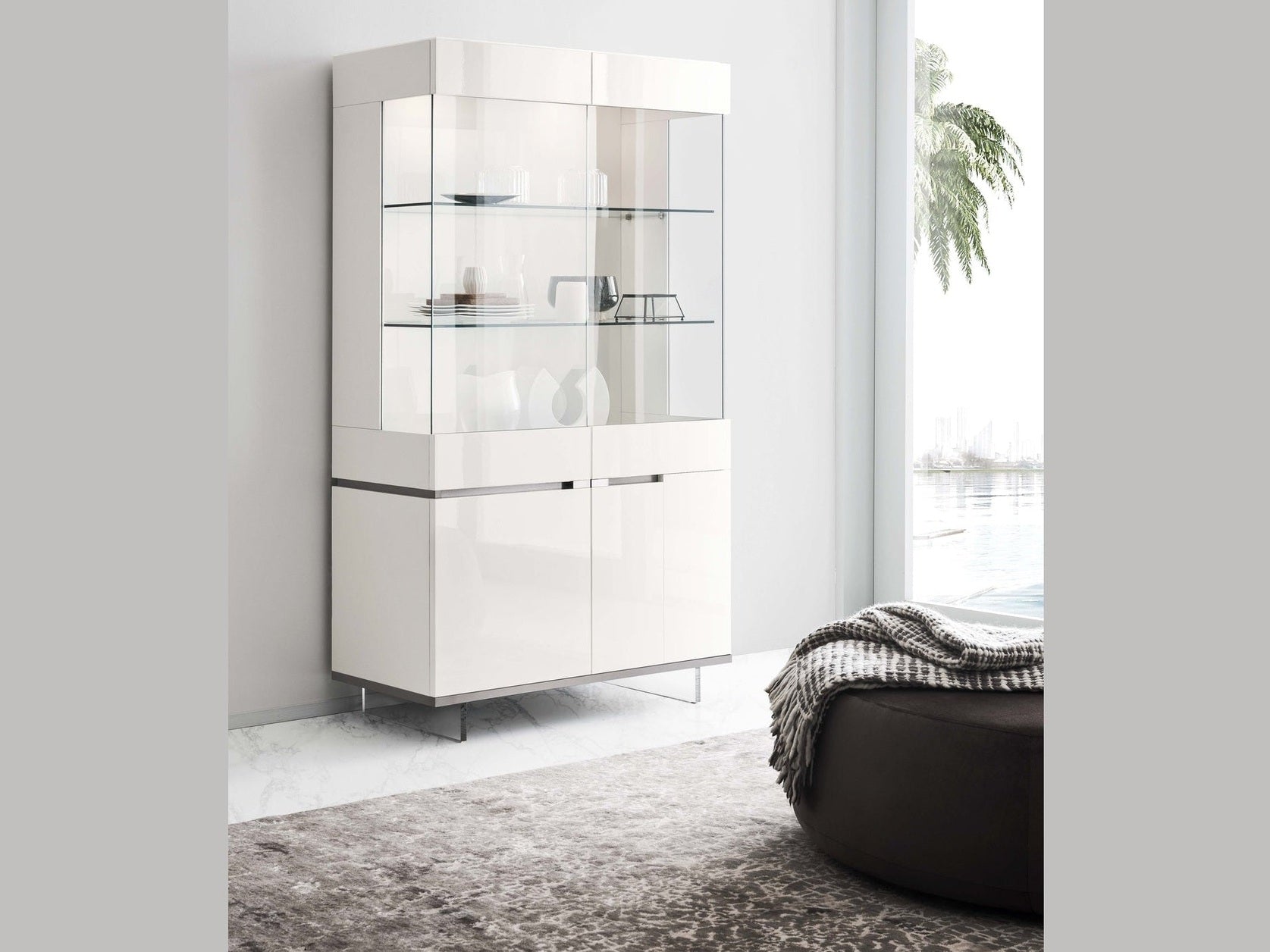 An Artemide white display cabinet in a minimalistic room with a window and rug.