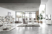 Artemide modern living room with a dining area featuring a white table and gray chairs.