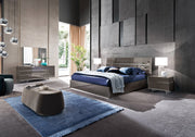 Athena modern bedroom with a bed, nightstands, and decorative elements.