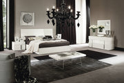 Canova modern bedroom set with black chandelier, white bed, and decorative elements.
