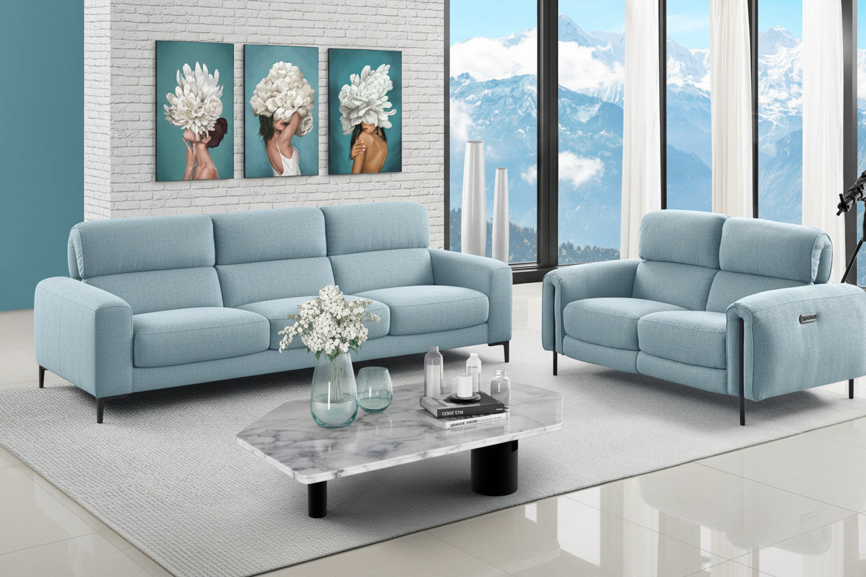 Charm Angel Blue sofa set in a modern living room with large windows showing mountains.