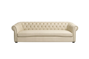 Beige tufted sofa on a white background