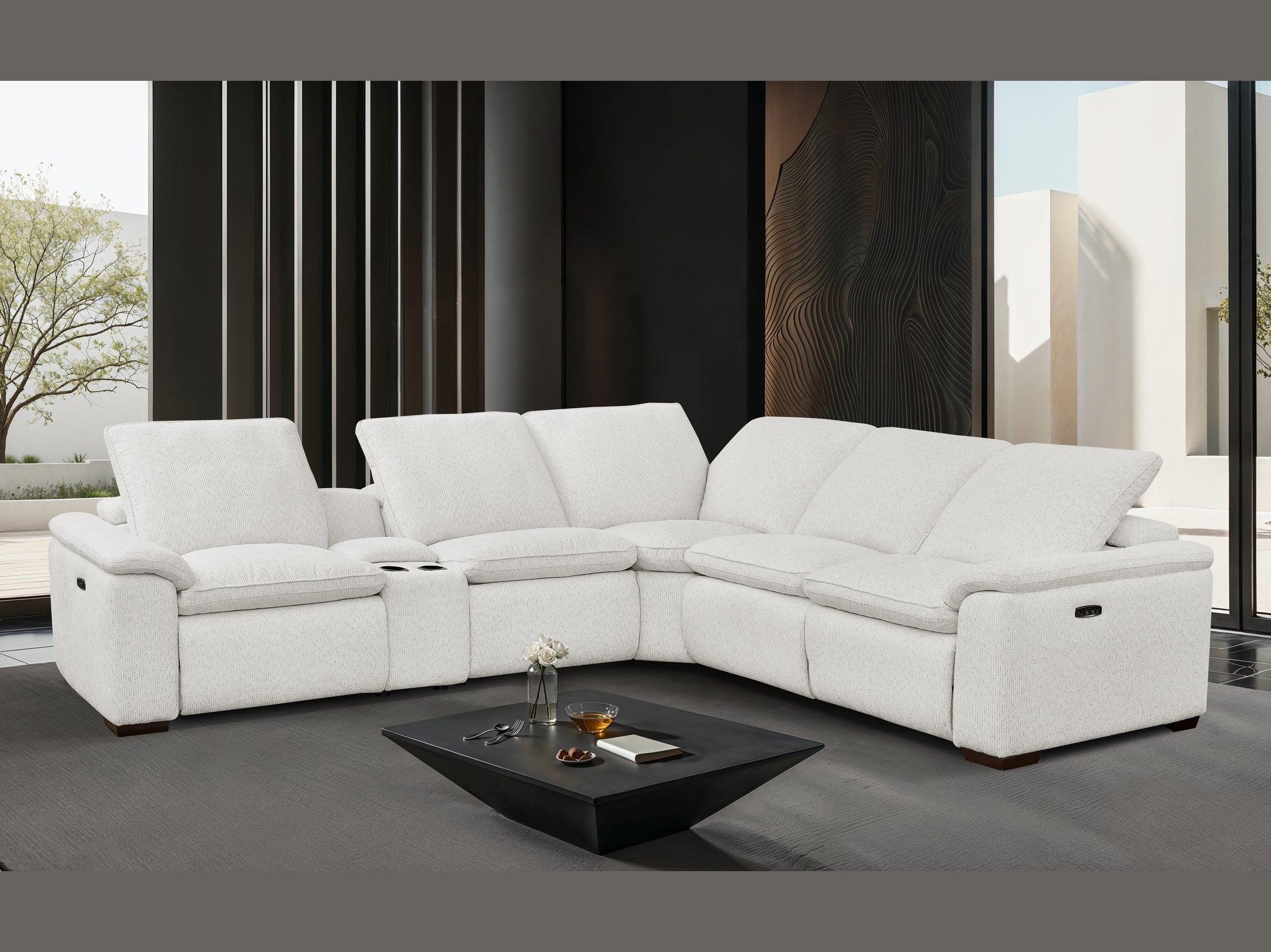 Cloudy white sectional sofa in a modern living room with a coffee table.