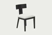 Edith side chairs with black frames and white cushioned seats on a wooden floor.