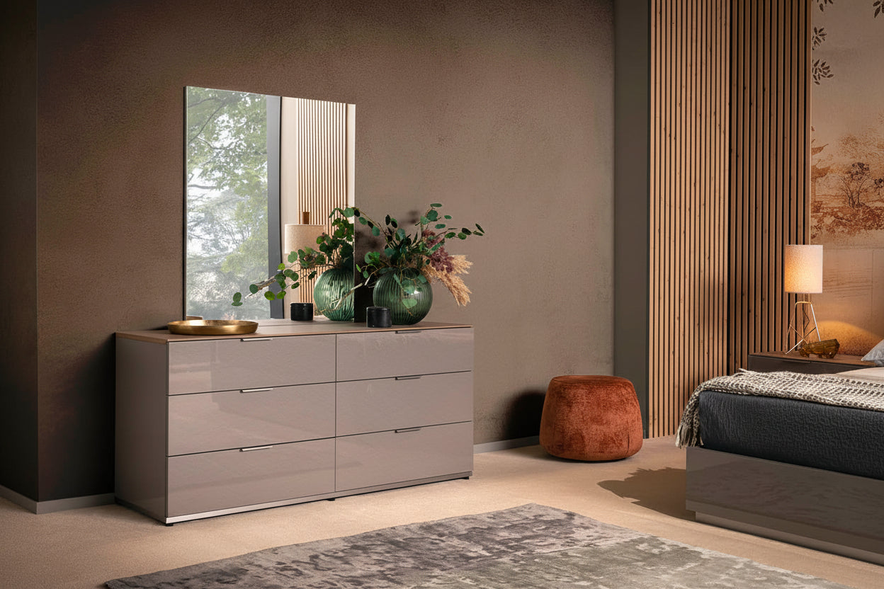 Fifth Avenue modern bedroom with a dresser, mirror, and bed.