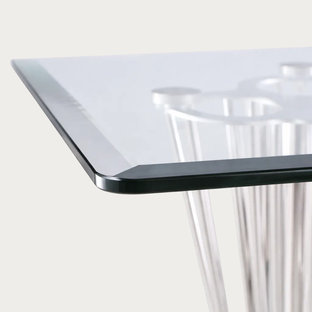 Fernanda glass table with metal legs on a white background