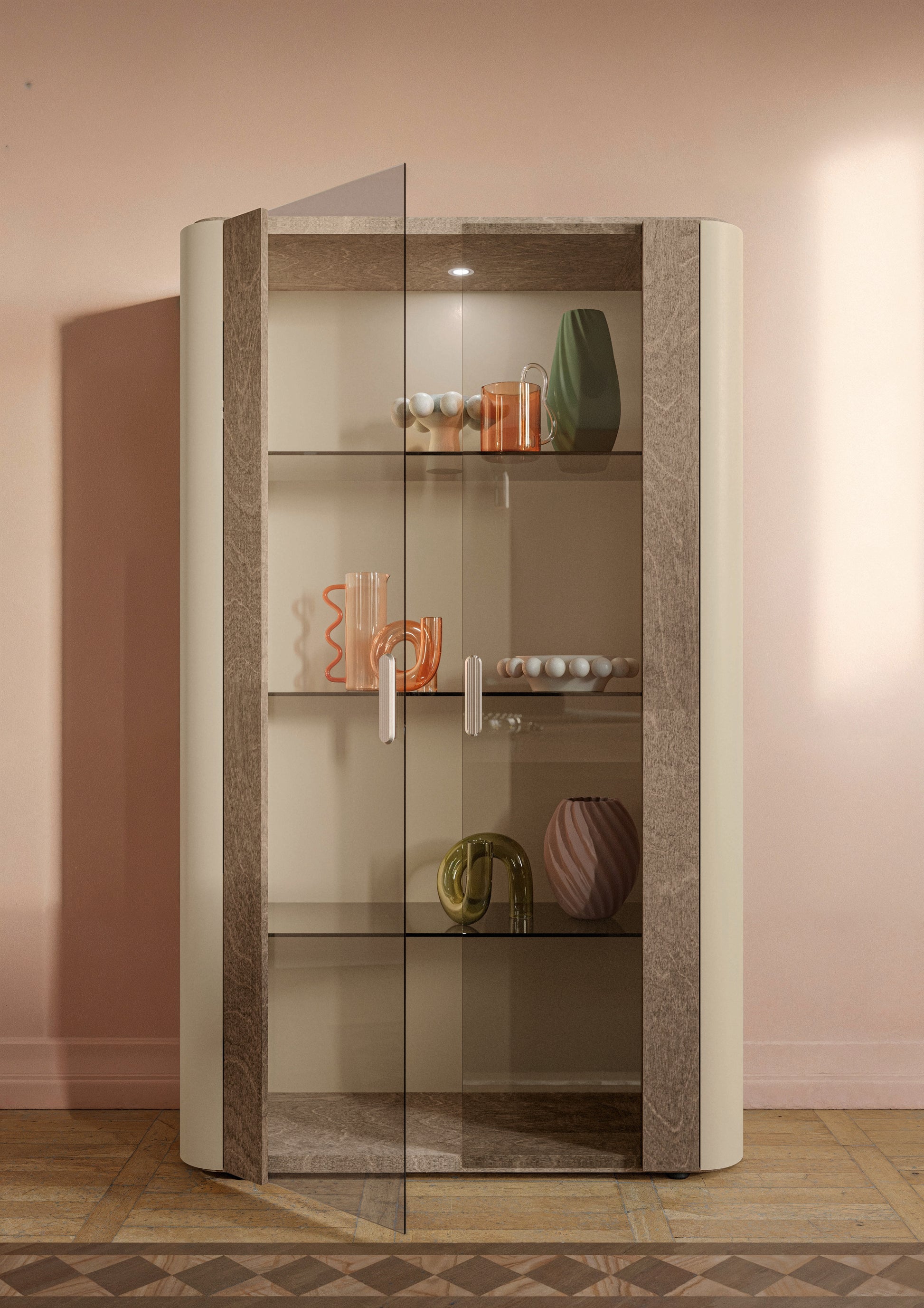 Hebe curio cabinet with glass shelves against a pink wall
