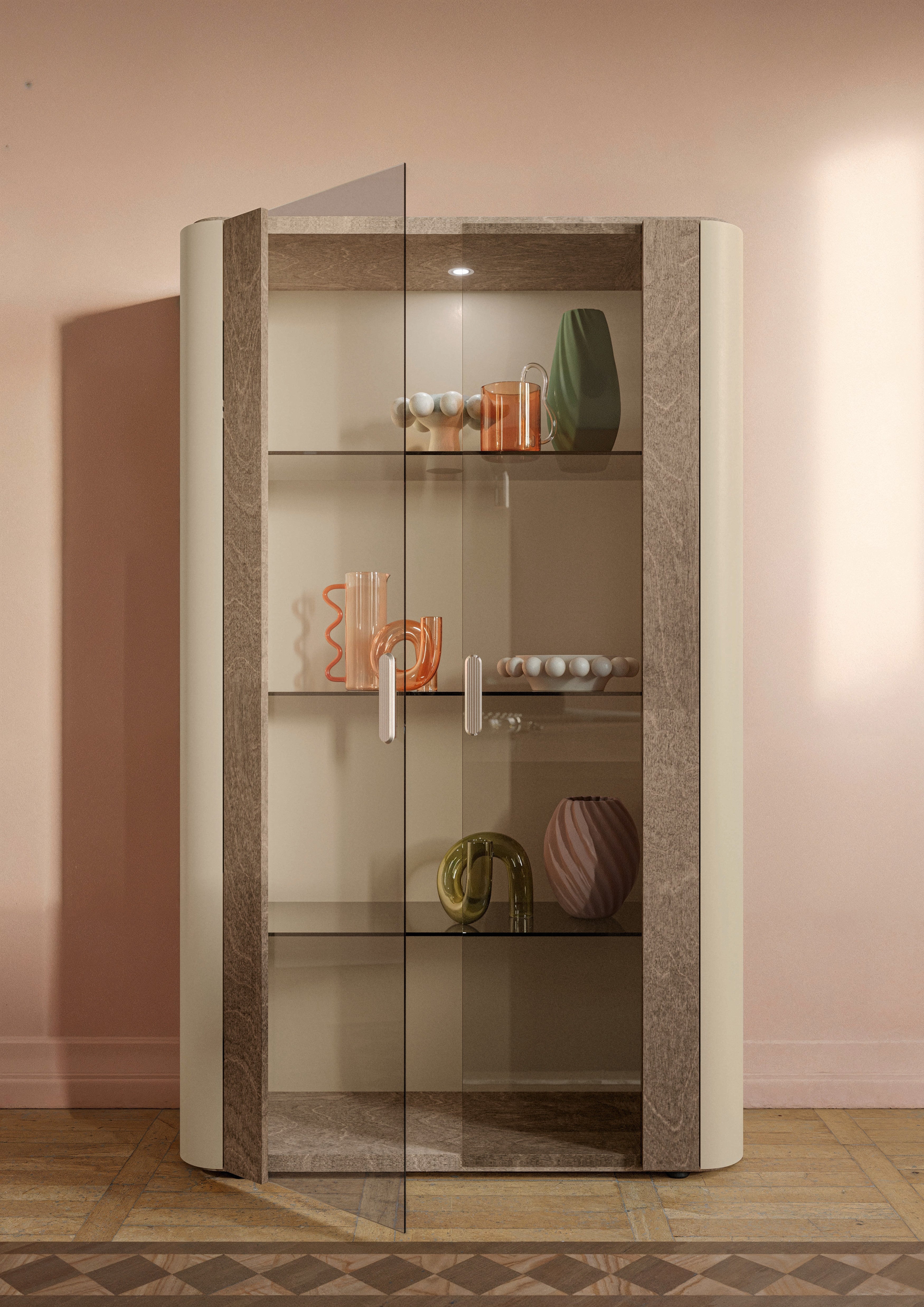 Hebe curio cabinet with glass shelves against a pink wall