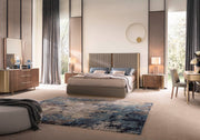 Hera modern bedroom with a bed, side tables, and decorative elements.