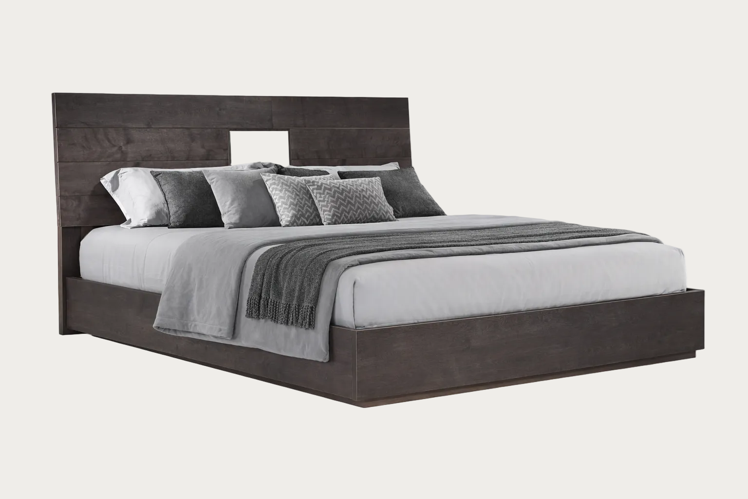 Heritage bed with dark wooden frame and gray bedding on a white background.