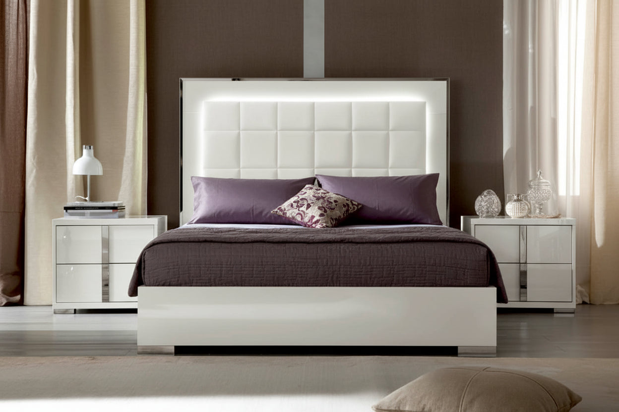 Imperia modern bedroom setup with a white bed and matching nightstands.