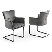Two Loran modern gray armchairs with quilted backrest on a white background.
