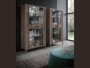 Two wooden display cabinets with glass doors in a modern room.