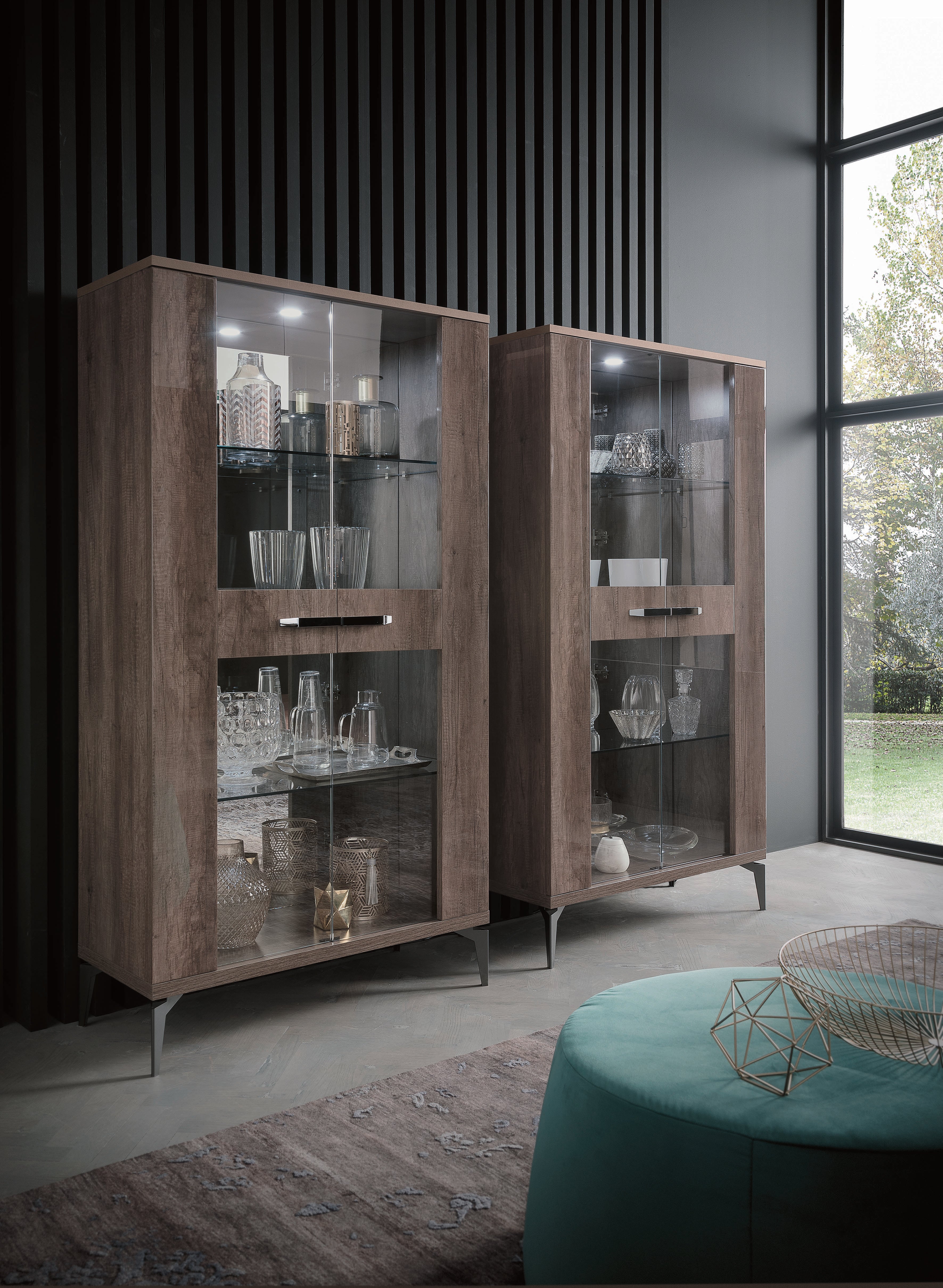 Two wooden display cabinets with glass doors in a modern room.