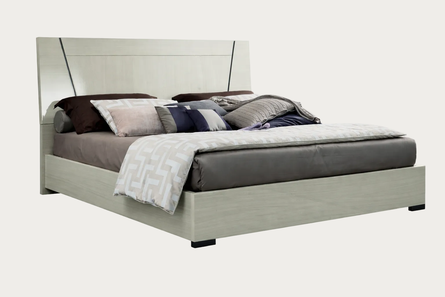 Mont Blanc bed with gray bedding and pillows on a white background.