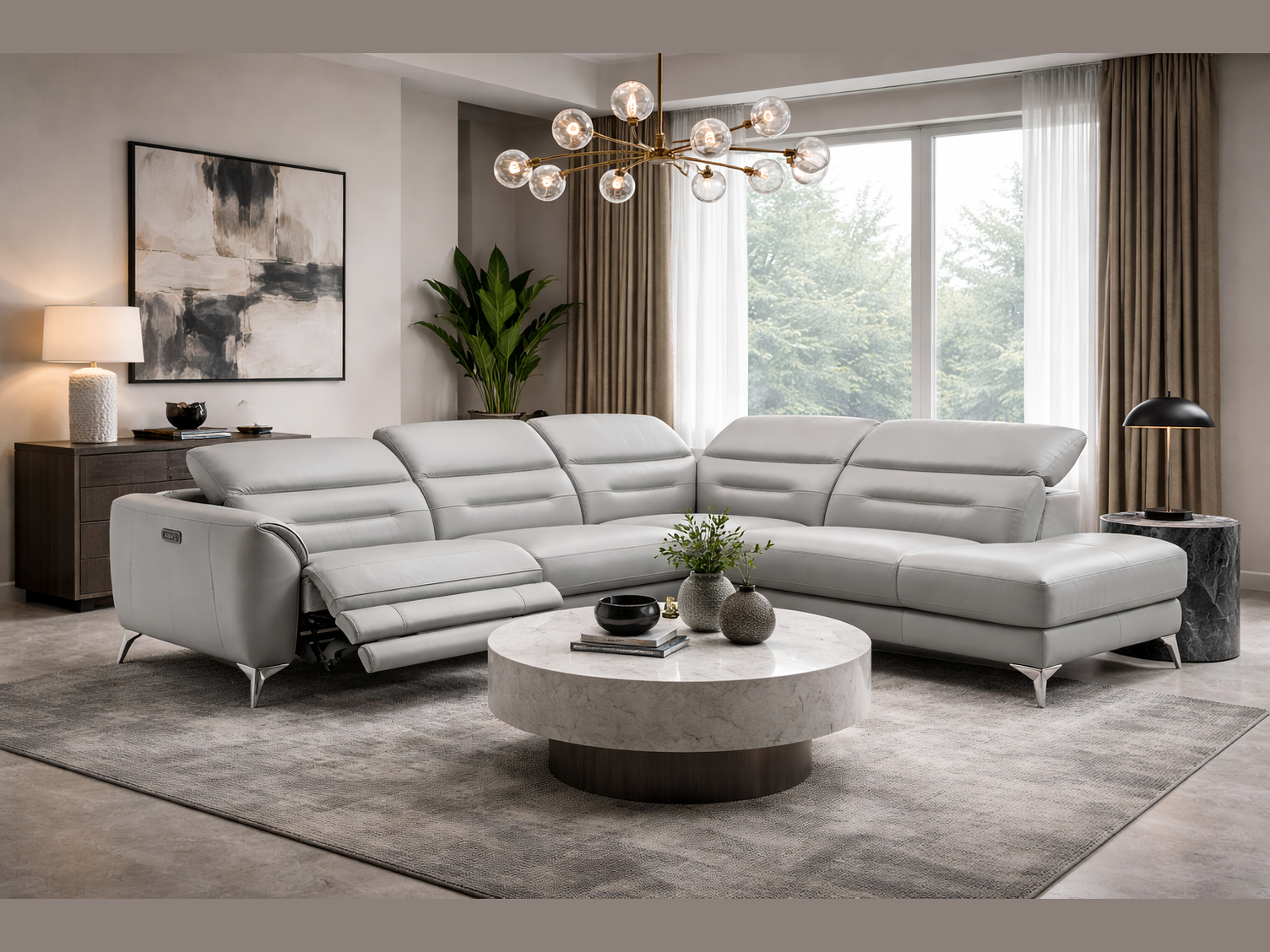 Modern living room with the Neo sectional sofa in grey leather, round coffee table, and decorative elements.