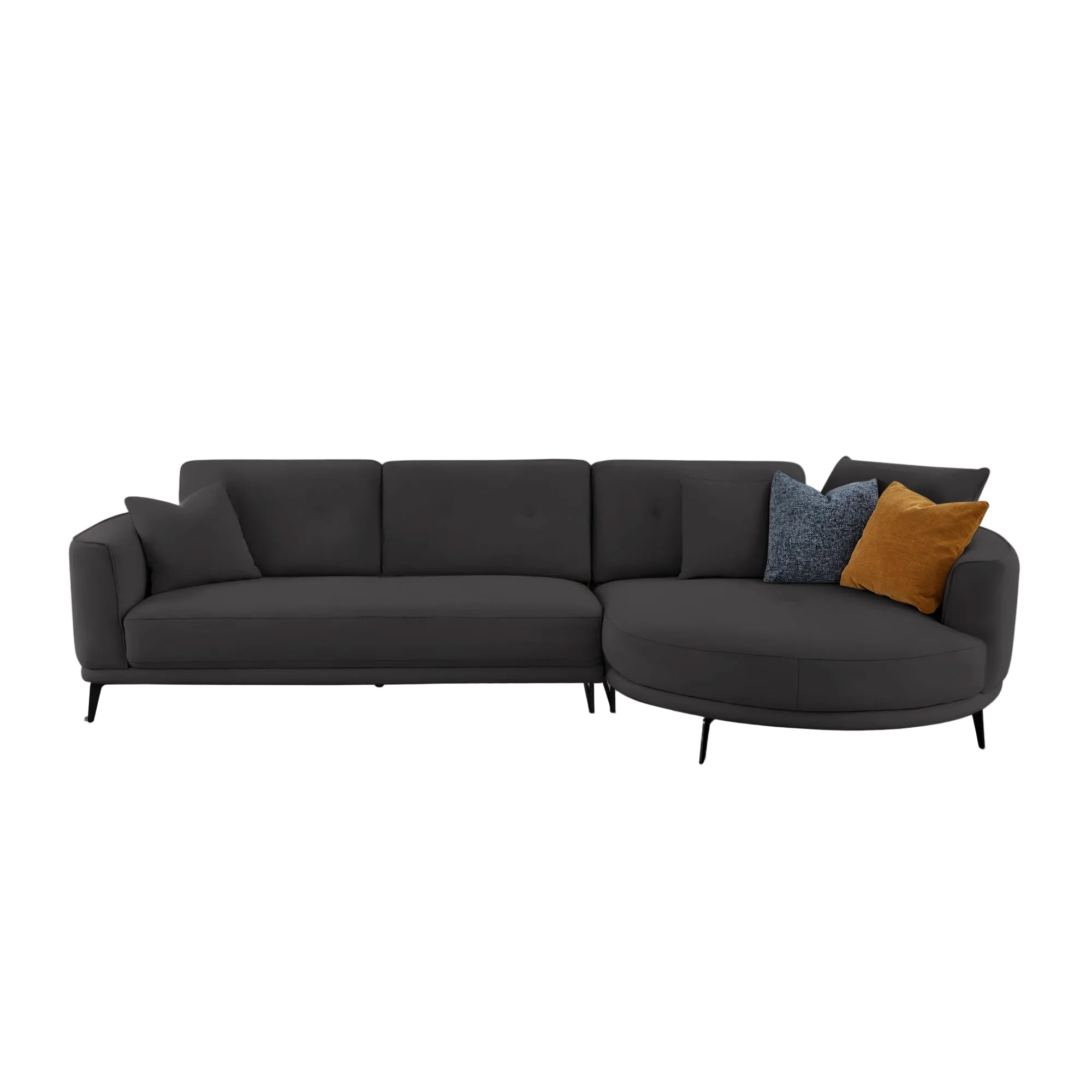 A modern dark gray sectional sofa with a left-facing armrest and a right-facing curved chaise, styled with three accent pillows in blue and mustard yellow, set against a plain light gray background.