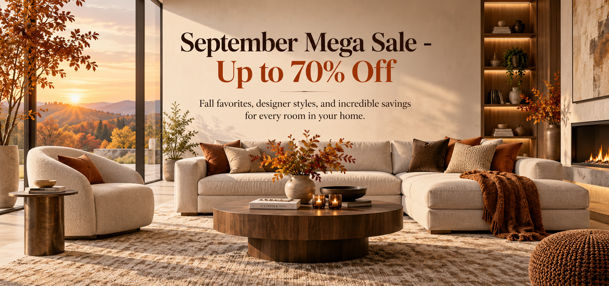 A promotional banner for a September Mega Sale showing a beautifully styled modern living room with a beige sectional sofa, round wooden coffee table, and warm autumn sunset view through large windows. The text overlay reads 'September Mega Sale - Up to 70% Off'.