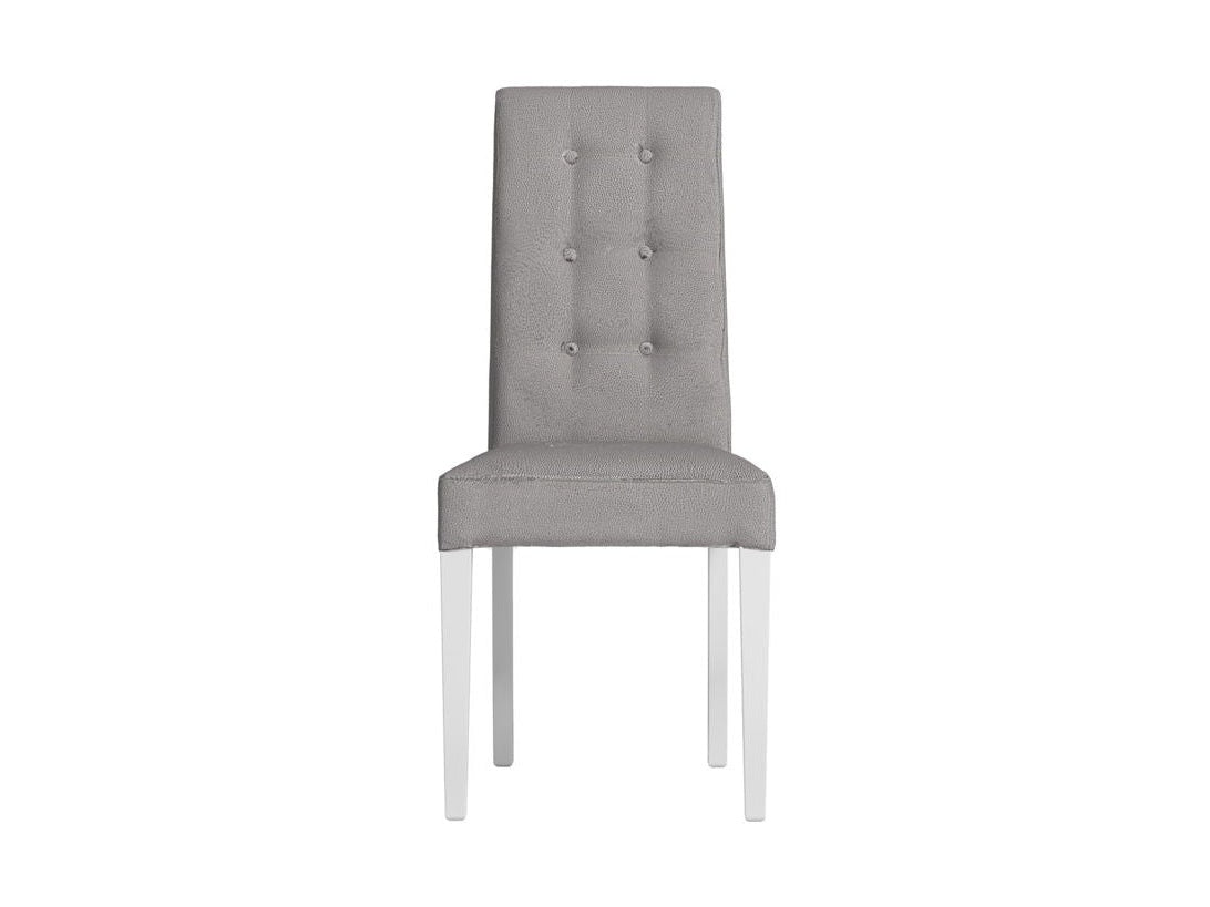 A modern dining chair with a tall, tufted backrest upholstered in light gray fabric, supported by slim white legs, shown against a plain white background.
