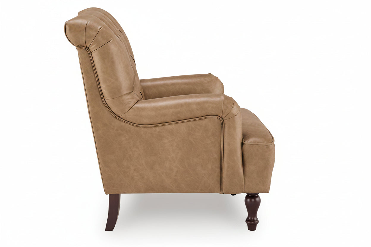 A classic tufted armchair in a warm tan leather or faux leather upholstery, featuring dark brown turned wooden legs, shown from a three-quarters angle against a white background.