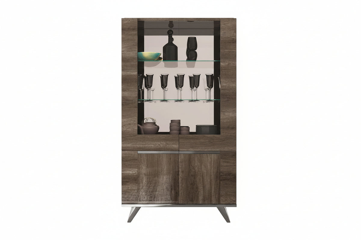 A modern tall hutch cabinet with a wood grain finish, featuring a glass-front upper section with shelves displaying glassware and bottles, and two lower wood grain doors with slim silver handles.