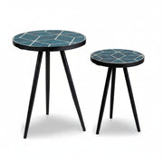Two Clairbelle round side tables with blue geometric patterned tops on a white background.