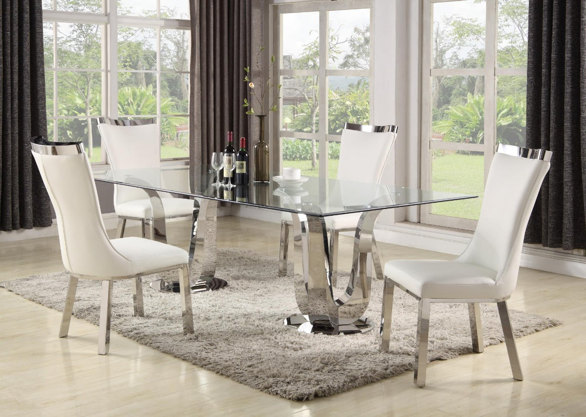Adelle dining room set with a glass-top table and white chairs in front of large windows.