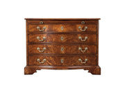 Wooden dresser with five drawers and brass handles on a white background