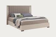 Jupiter beige bed with upholstered headboard and pillows on a white background.