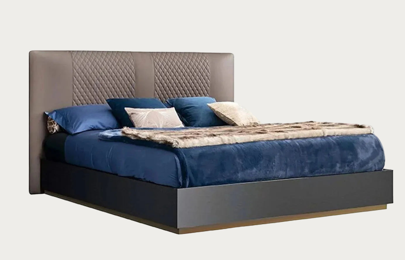 Oceanum bed with blue bedding and decorative pillows on a white background.