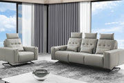 Amalfi gray sofa and armchair set in a modern living room with large windows.