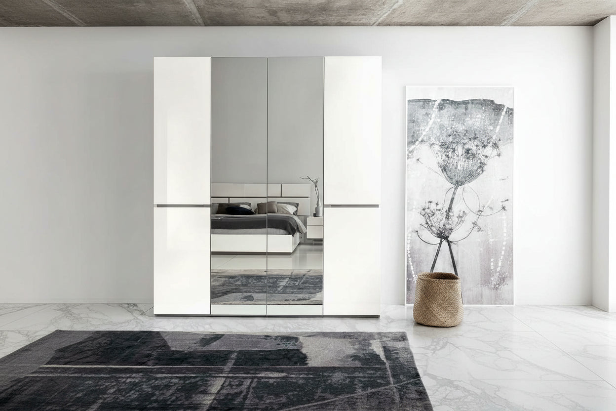 Artemide modern bedroom with a large mirror on a white wall, a gray floor, and decorative elements.