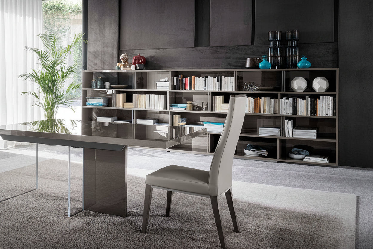 Modern office setup with a desk, chair, and bookshelf.