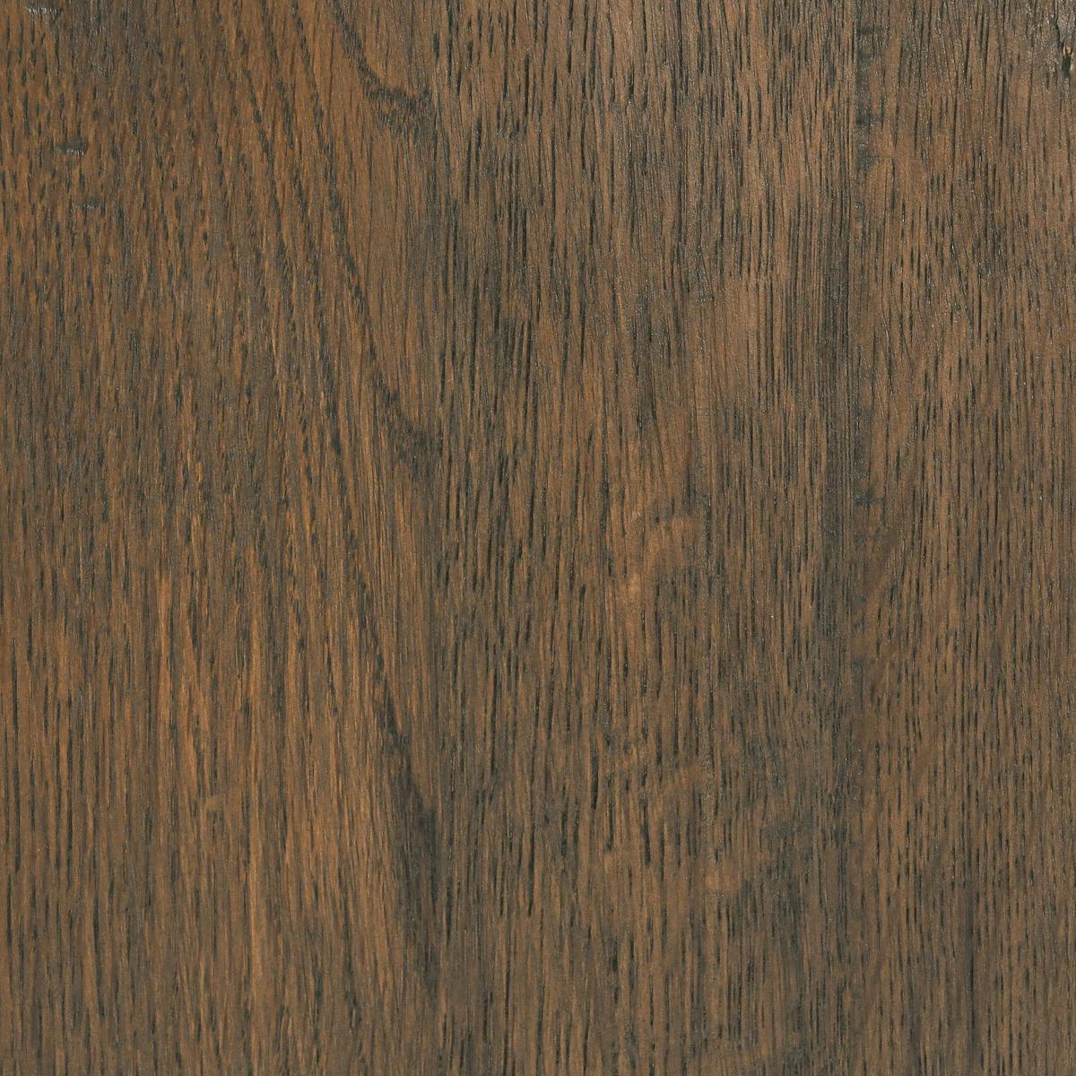 Close-up of a wooden surface with a dark brown color and visible grain pattern.